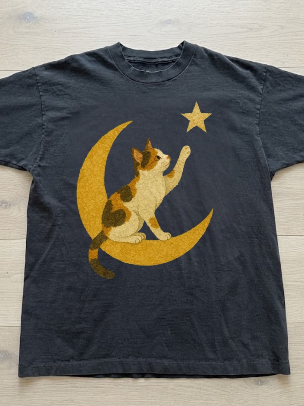 Calico Cat Reaching for a Star on a Yellow Crescent Moon Vintage Black T-Shirt